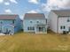 Aerial view of a light blue house with a backyard at 518 Switch St, York, SC 29745