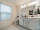 Main bathroom boasts double sinks, a large mirror, and tile flooring at 518 Switch St, York, SC 29745