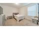 Cozy bedroom with dresser and a bed, featuring a window with blinds at 518 Switch St, York, SC 29745