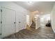 Bright entryway with stairs, powder room, and wood-look flooring at 518 Switch St, York, SC 29745