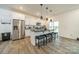 Modern kitchen with white cabinets, granite counters, and stainless steel appliances at 518 Switch St, York, SC 29745