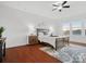 Main bedroom with hardwood floors and ceiling fan at 523 Rock Skip Way, Fort Mill, SC 29708