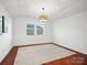 Bright bedroom featuring hardwood floors and a large window at 523 Rock Skip Way, Fort Mill, SC 29708