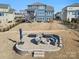 Stone fire pit with built-in seating on a large patio at 523 Rock Skip Way, Fort Mill, SC 29708