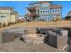 Outdoor fire pit with seating on a brick patio at 523 Rock Skip Way, Fort Mill, SC 29708