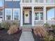 Welcoming front porch with brick steps and white columns at 523 Rock Skip Way, Fort Mill, SC 29708