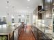 Modern kitchen with dark brown cabinets and granite countertops at 523 Rock Skip Way, Fort Mill, SC 29708