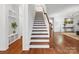 Elegant staircase with hardwood treads and white risers at 523 Rock Skip Way, Fort Mill, SC 29708