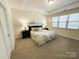 Bright bedroom with neutral tones, accent lighting, and a door leading to the closet at 577 Rustlewood Way, Rock Hill, SC 29732