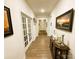 Bright hallway with wood floors, decorative runner, and beautiful french doors at 577 Rustlewood Way, Rock Hill, SC 29732