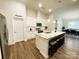 Modern kitchen featuring white cabinets, center island with seating, and stainless steel appliances at 577 Rustlewood Way, Rock Hill, SC 29732