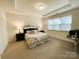 Bright main bedroom features tray ceiling, neutral carpet, and ensuite at 577 Rustlewood Way, Rock Hill, SC 29732