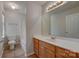 Bathroom with a bathtub, toilet, double sink vanity, and a mirrored medicine cabinet at 5813 Bridgeway Dr, Indian Trail, NC 28079