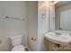 Small bathroom with a pedestal sink and toilet at 5813 Bridgeway Dr, Indian Trail, NC 28079