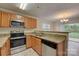 Spacious kitchen with stainless steel appliances and granite countertops at 5813 Bridgeway Dr, Indian Trail, NC 28079