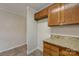 Kitchen boasts wood cabinets and granite countertops at 5813 Bridgeway Dr, Indian Trail, NC 28079