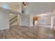 Open concept living area with hardwood floors, high ceilings, and a staircase at 5813 Bridgeway Dr, Indian Trail, NC 28079