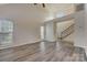 Spacious living room with hardwood floors, large windows, and a high ceiling at 5813 Bridgeway Dr, Indian Trail, NC 28079