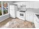 Kitchen with white cabinets and tiled floors at 609 Mountainwater Dr, Charlotte, NC 28262