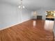 Living room with hardwood floors, fireplace and chandelier at 609 Mountainwater Dr, Charlotte, NC 28262