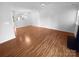 Hardwood floor living room, open to kitchen and stairs at 609 Mountainwater Dr, Charlotte, NC 28262