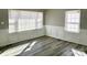 Bright living room with wainscoting and hardwood floors at 624 Windy Hill Dr, Gastonia, NC 28052