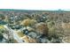 Aerial view of a residential neighborhood showcasing tree-lined streets and homes at 6309 Spring Garden Ln, Charlotte, NC 28213