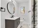 Modern bathroom with floating vanity and walk-in shower at 6309 Spring Garden Ln, Charlotte, NC 28213