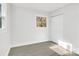 Simple bedroom with neutral walls and wood-look floors at 6309 Spring Garden Ln, Charlotte, NC 28213