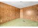 Empty bedroom with wood paneling and green carpet at 643 Alf Hoover Rd, Lincolnton, NC 28092