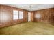 Simple bedroom with wood paneling and carpeted floor at 643 Alf Hoover Rd, Lincolnton, NC 28092