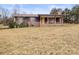 Brick ranch house with covered porch and large yard at 643 Alf Hoover Rd, Lincolnton, NC 28092