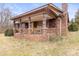 Brick ranch house with covered porch and large yard at 643 Alf Hoover Rd, Lincolnton, NC 28092