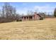 Brick ranch house with covered porch and large yard at 643 Alf Hoover Rd, Lincolnton, NC 28092