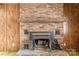 Brick fireplace with wood mantel in living room at 643 Alf Hoover Rd, Lincolnton, NC 28092