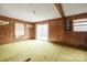 Living room with sliding glass doors and wood paneling at 643 Alf Hoover Rd, Lincolnton, NC 28092