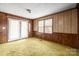 Living area with sliding glass doors and wood paneling at 643 Alf Hoover Rd, Lincolnton, NC 28092