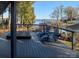 Deck area with hot tub and Adirondack chairs overlooking lake at 670 Allenton St, Norwood, NC 28128