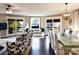 Bright living room with lake views from the windows and sliding doors, connecting indoor and outdoor living spaces at 670 Allenton St, Norwood, NC 28128