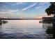 Beautiful lake view showcasing the tranquil water and scenic shoreline at sunset at 670 Allenton St, Norwood, NC 28128