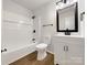 Clean and modern bathroom with updated vanity and fixtures at 7015 Cardigan Ave, Charlotte, NC 28215