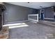 Living room with a split level and view into the kitchen and dining areas at 7912 Charter Oak Ln, Charlotte, NC 28226