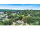 Aerial view of the house and surrounding neighborhood with lush green trees at 815 3Rd St, Kings Mountain, NC 28086