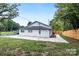 Newly built home with a large backyard and a concrete patio at 815 3Rd St, Kings Mountain, NC 28086