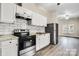 Modern kitchen with white cabinets, granite countertops and stainless steel appliances at 815 3Rd St, Kings Mountain, NC 28086