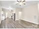 Open living area with hardwood floors and ceiling fan at 815 3Rd St, Kings Mountain, NC 28086