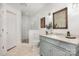 Cozy bathroom featuring a glass shower, toilet, vanity, and decorative mirror at 821 Greentree Dr, Charlotte, NC 28211