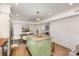 Bright kitchen featuring stainless steel appliances, an island with a granite countertop, and a clear view into the living area at 821 Greentree Dr, Charlotte, NC 28211