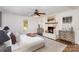 Spacious main bedroom featuring a fireplace, ceiling fan, and large windows at 821 Greentree Dr, Charlotte, NC 28211