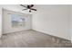 Bedroom with a large window, neutral carpet and white walls at 8312 Compton Acres Ln, Waxhaw, NC 28173